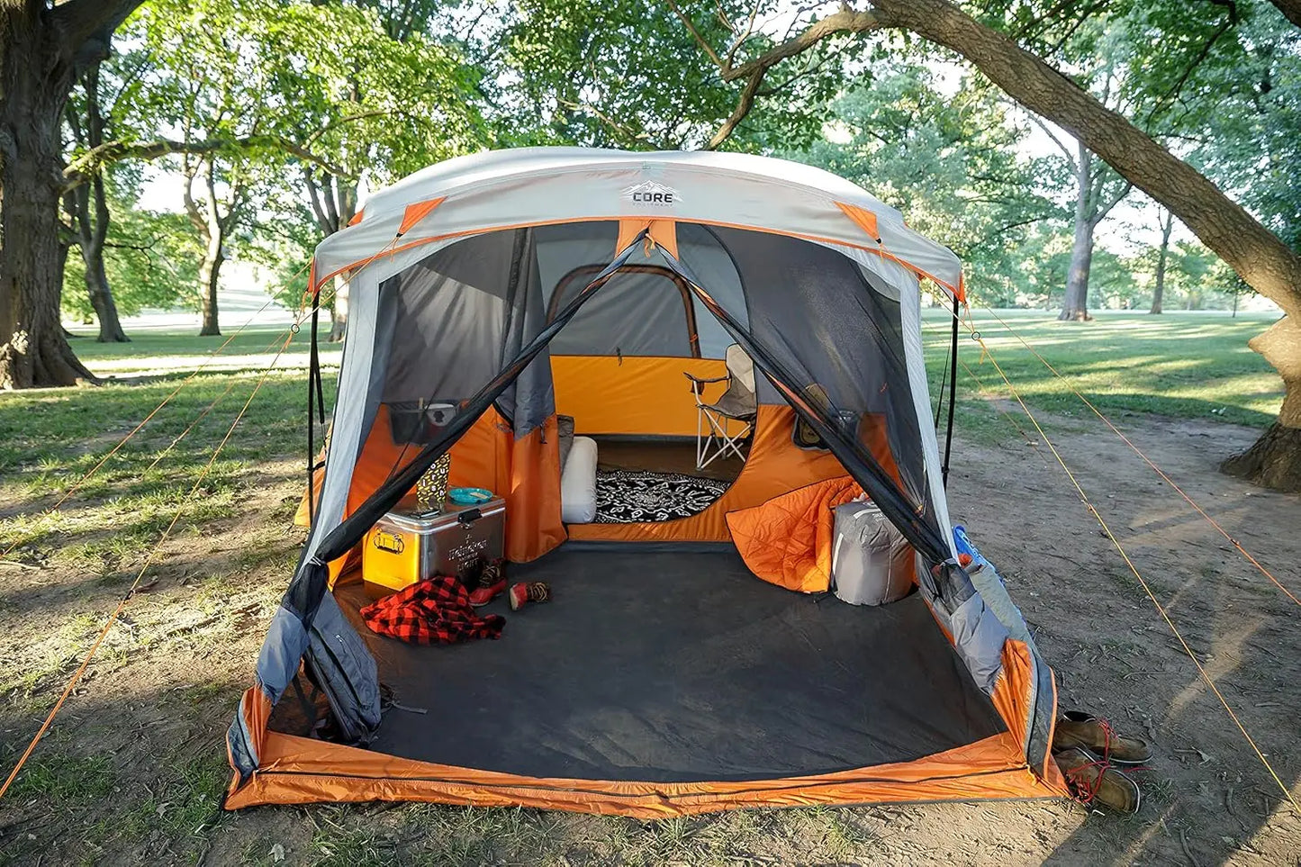 CORE 11-person family cabin tent with screen room, multiple rooms, storage pockets, and portable carry bag for outdoor camping.